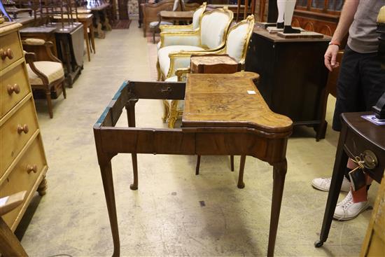 A George I figured walnut concertina action folding card table, W.78cm, D.39cm, H.72cm